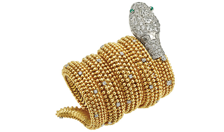 Serpenti bracelet-watch in gold and platinum with emeralds and diamonds, ca. 1955