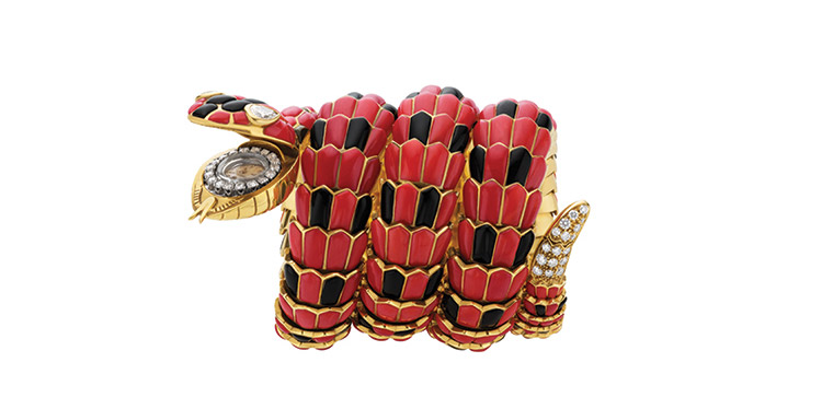 Serpenti bracelet watch in gold with coral, onyx and diamonds, ca. 1970